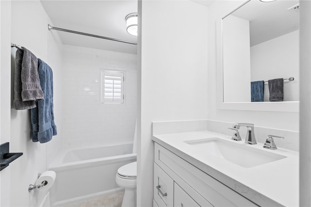 full bathroom with toilet, vanity, tiled shower / bath, and tile patterned floors