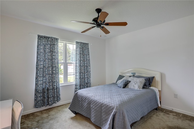 bedroom featuring ceiling fan and light colored carpet