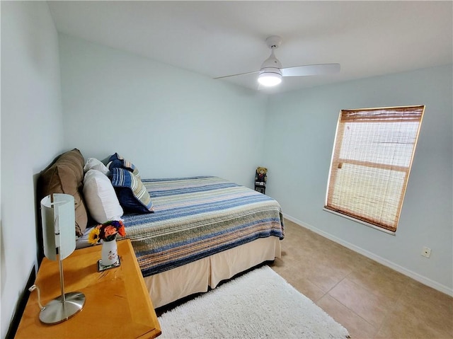 bedroom featuring light tile patterned floors and ceiling fan