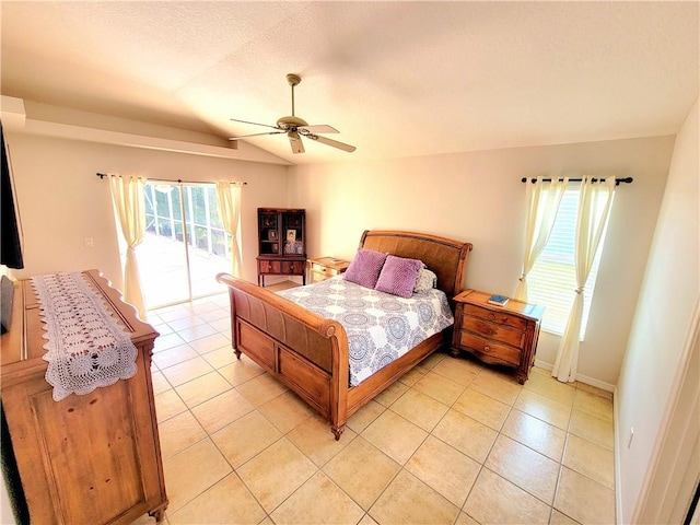 bedroom featuring vaulted ceiling, light tile patterned flooring, access to exterior, and ceiling fan