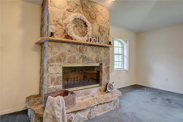 carpeted living room with a fireplace and vaulted ceiling