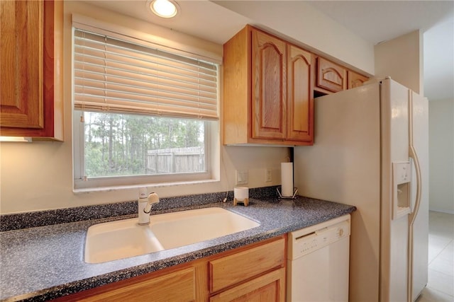 kitchen with white appliances and sink