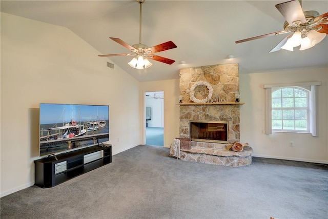 living room featuring ceiling fan, carpet flooring, a fireplace, and vaulted ceiling