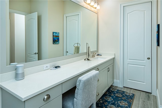 bathroom with vanity and hardwood / wood-style flooring