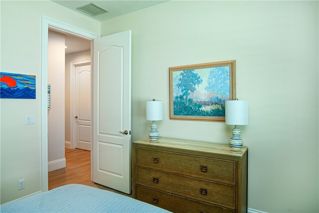 bedroom featuring light hardwood / wood-style floors