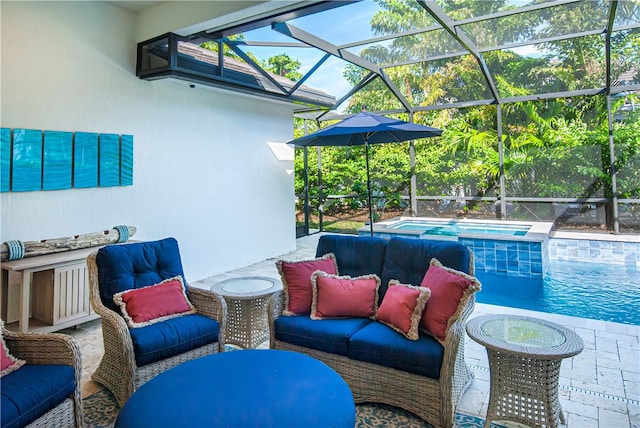 view of pool featuring a patio, glass enclosure, and an in ground hot tub