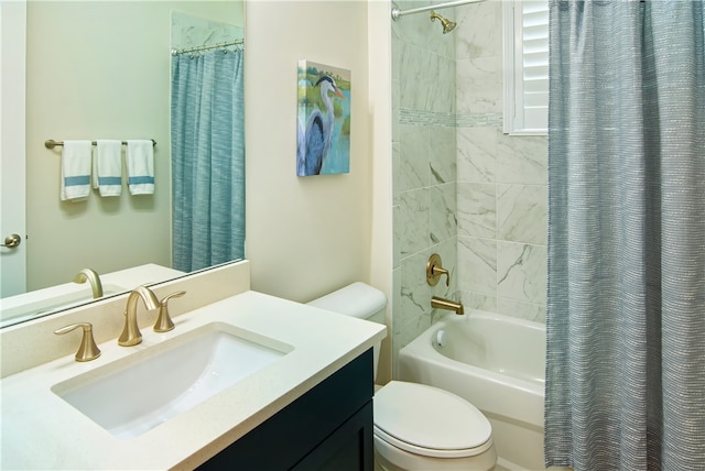 full bathroom with shower / tub combo with curtain, vanity, and toilet