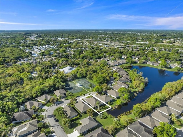 birds eye view of property featuring a residential view and a water view