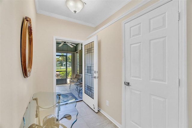 entrance foyer featuring ceiling fan, baseboards, and ornamental molding