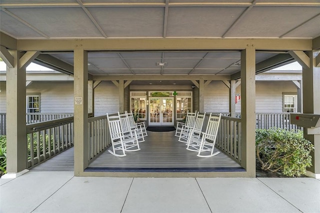 view of patio / terrace featuring french doors and covered porch