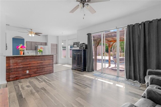 4565 61st Ter, Vero Beach, FL 32967 - living room featuring ceiling fan and light wood finished floors