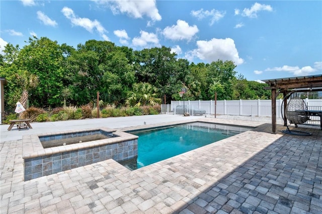 4565 61st Ter, Vero Beach, FL 32967 - view of pool featuring a patio area, fence, view of wooded area, and an in-ground hot tub