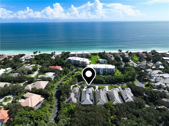 bird's eye view featuring a water view, a residential view, and a view of the beach