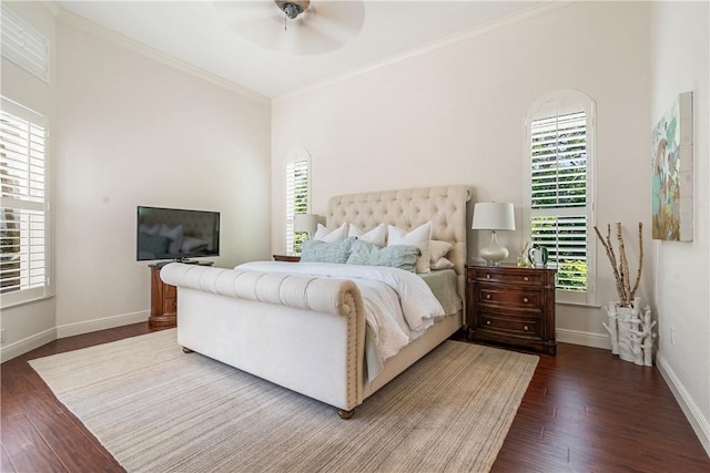 bedroom featuring ornamental molding, dark wood finished floors, baseboards, and a ceiling fan