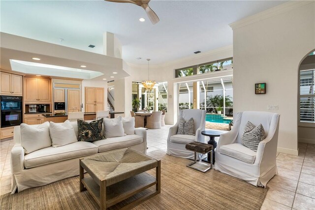 dining space featuring a wealth of natural light, light tile patterned floors, and a notable chandelier