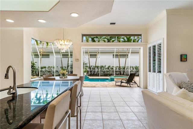 interior space featuring a sink and a notable chandelier