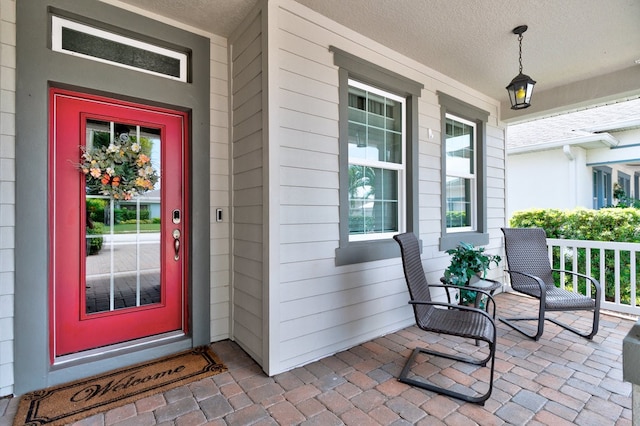 property entrance featuring covered porch