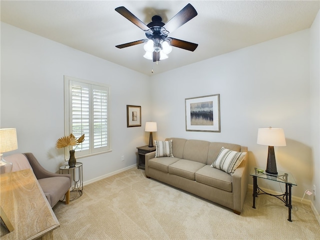 living room featuring light carpet and ceiling fan