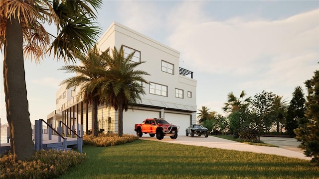 5290 94th Ln, Sebastian, FL 32958 - view of building exterior with a garage, driveway, and stairway