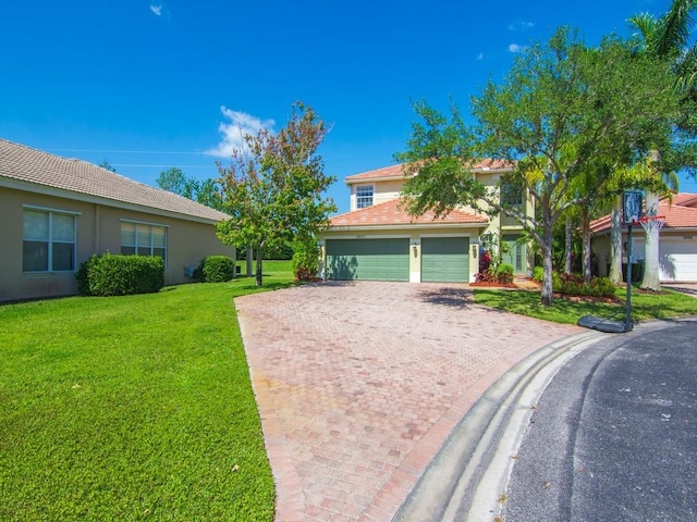 view of front of house featuring a tiled roof, a garage, stucco siding, a front yard, and driveway