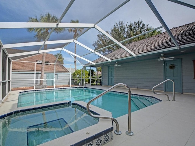 view of pool featuring a lanai, a pool with connected hot tub, a ceiling fan, and a patio