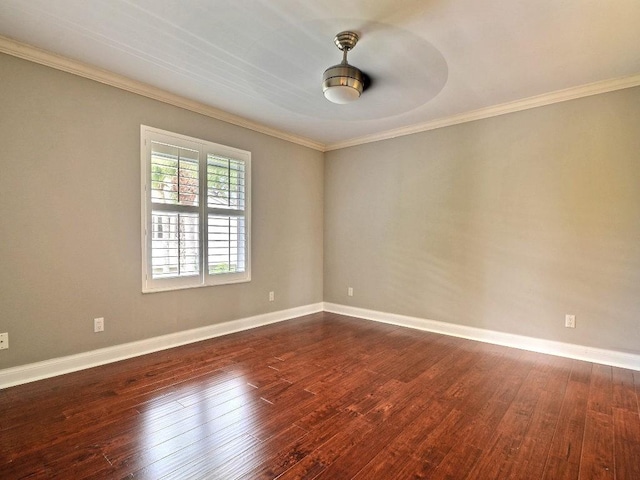 empty room with dark wood-style floors, ceiling fan, baseboards, and crown molding