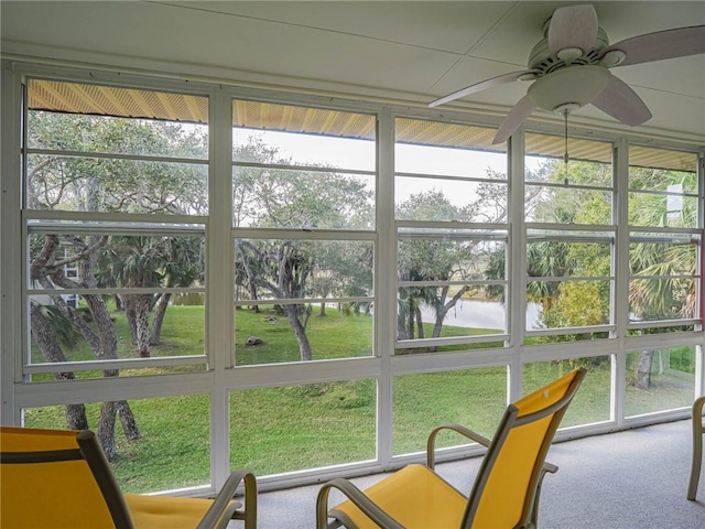 sunroom with a ceiling fan and plenty of natural light