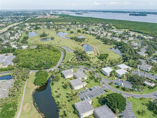 bird's eye view featuring a water view and a residential view