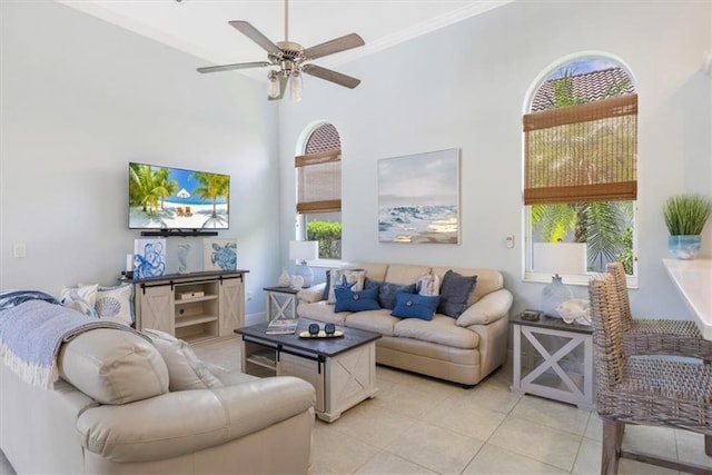 2214 Falls Cir, Vero Beach, FL 32967 - tiled living room with crown molding, ceiling fan, and a high ceiling