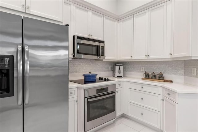 2214 Falls Cir, Vero Beach, FL 32967 - kitchen with white cabinetry and stainless steel appliances