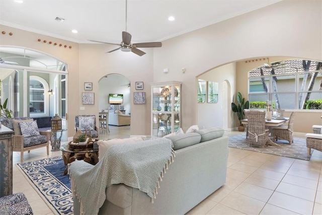 2214 Falls Cir, Vero Beach, FL 32967 - tiled living room featuring crown molding, a healthy amount of sunlight, and ceiling fan