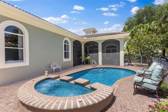 2214 Falls Cir, Vero Beach, FL 32967 - view of pool with a patio area and an in ground hot tub