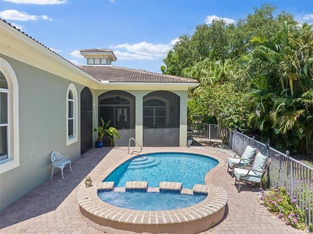 2214 Falls Cir, Vero Beach, FL 32967 - view of pool featuring a patio area and an in ground hot tub