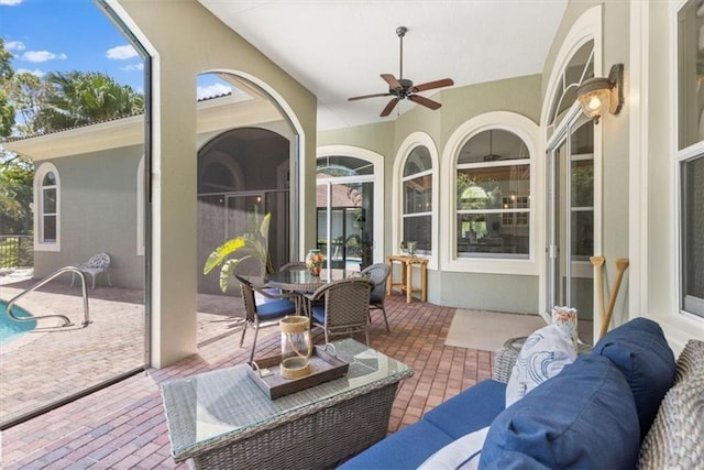 sunroom / solarium with ceiling fan