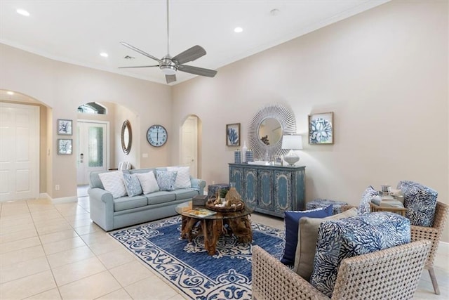 2214 Falls Cir, Vero Beach, FL 32967 - living room with crown molding, ceiling fan, and light tile patterned floors