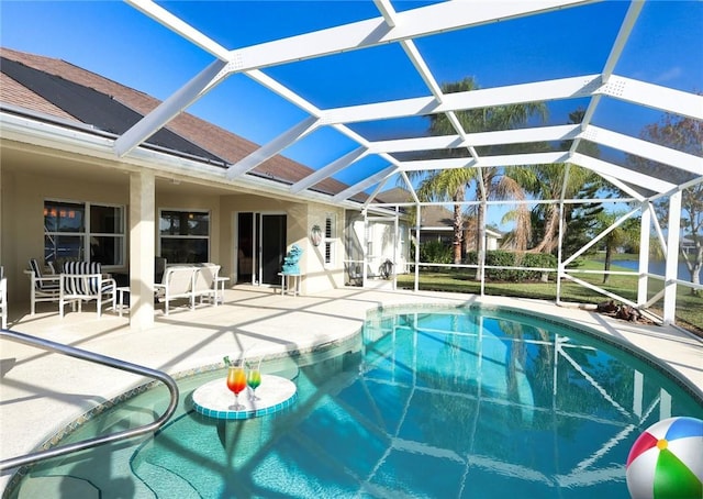 5688 Riverboat Cir SW, Vero Beach, FL 32968 - outdoor pool featuring a patio and a lanai