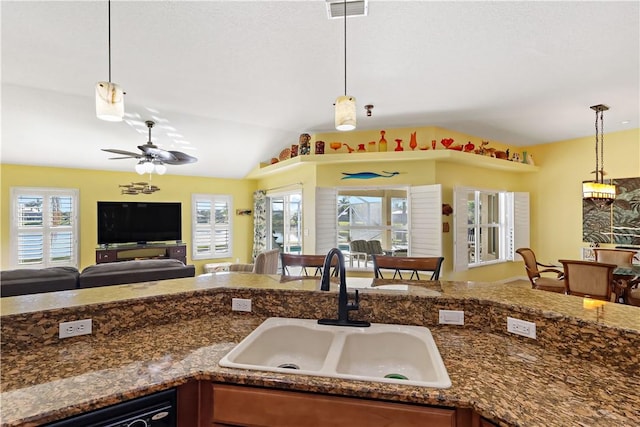 5688 Riverboat Cir SW, Vero Beach, FL 32968 - kitchen with a sink, open floor plan, pendant lighting, vaulted ceiling, and a ceiling fan