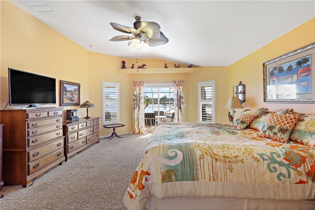 5688 Riverboat Cir SW, Vero Beach, FL 32968 - bedroom featuring carpet, lofted ceiling, access to outside, and ceiling fan