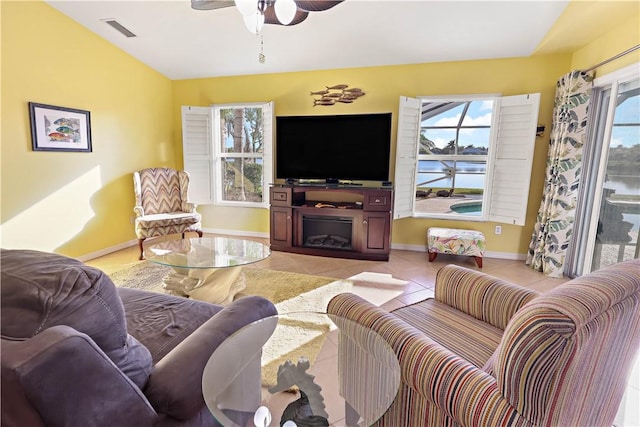5688 Riverboat Cir SW, Vero Beach, FL 32968 - living area with light tile patterned floors, a ceiling fan, and baseboards