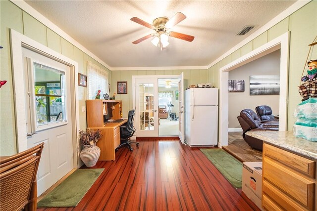 interior space featuring a wealth of natural light, french doors, dark wood-style flooring, and visible vents