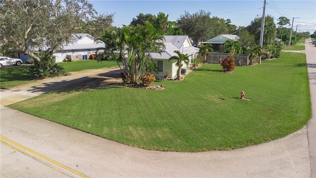 exterior space with driveway and fence