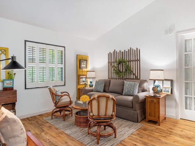 living area featuring light wood-type flooring and baseboards