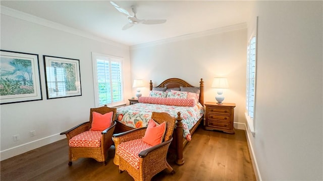 bedroom featuring ceiling fan, dark hardwood / wood-style floors, and crown molding