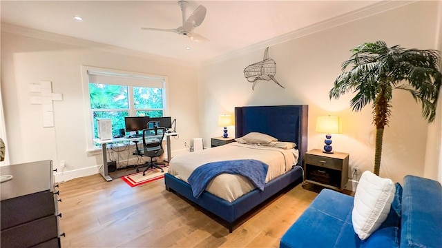 bedroom featuring ceiling fan, wood-type flooring, and crown molding