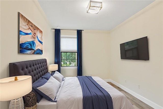 4487 Beauty Leaf Cir, Vero Beach, FL 32967 - bedroom with wood finished floors and baseboards