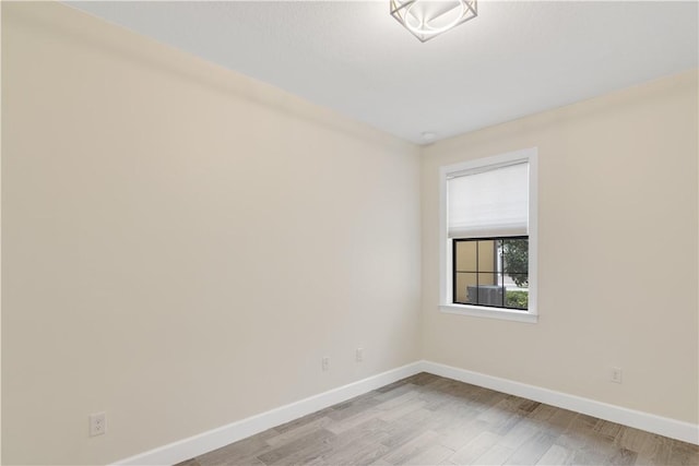 unfurnished room with light hardwood / wood-style floors