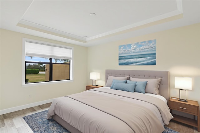 4487 Beauty Leaf Cir, Vero Beach, FL 32967 - bedroom with a tray ceiling, baseboards, and wood finished floors