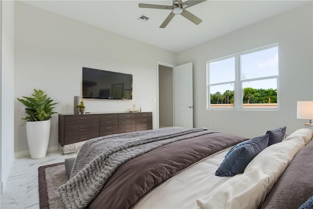 bedroom featuring marble finish floor, visible vents, and a ceiling fan