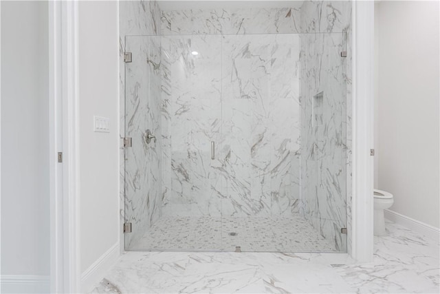 full bathroom with a marble finish shower, marble finish floor, baseboards, and toilet