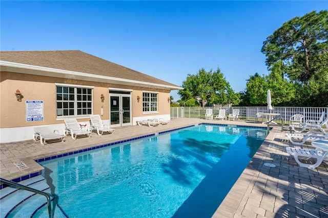 view of swimming pool with a patio